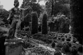 Black and white image of a large formal garden and statuary