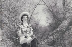 Cover of 'Lukens Life' newsletter, featuring a female employee fishing in a creek