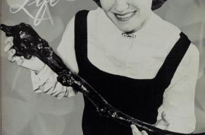 Cover of Lukens Life. Black and white clover pattern and photograph of a woman holding a shillelagh 