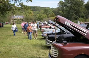 Row of cars with engines displayed