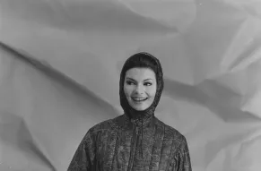 Fashion photograph of a woman in a ski parka.