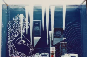 Photograph of a store window displaying DuPont winter car products.