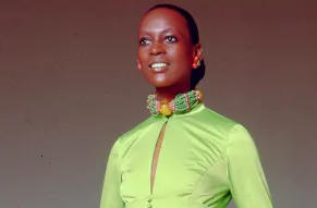 African-American woman in a green dress