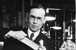 Dr. Wallace H. Carothers with neoprene