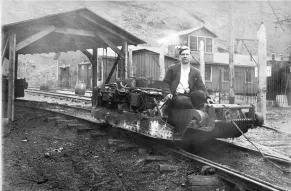 Man operating a mine haulage train 