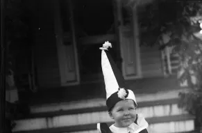 Toddler in a clown costume