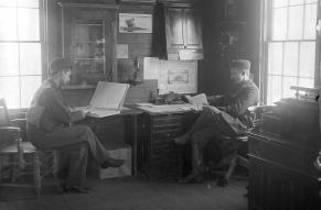 Two men at work in an office, circa. 1895.