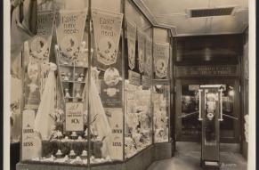 Black and white image of a 5&10 cent store window decorated for Easter.