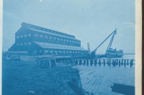 Cyanotype photograph showing a shipyard's fitting out shop and sheers