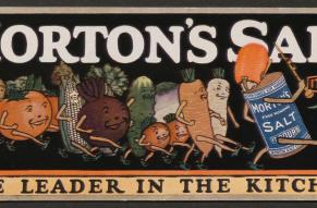 Illustration of vegetables marching behind a canister of salt. Text is "the leader in the kitchen"