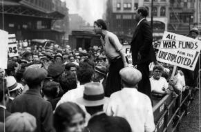   This photograph shows June Croll, a representative of the Communist-affiliated National Textile Workers Union, speaking at a Jobless March that occurred in New York City on July 7, 1931