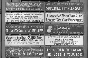 Photograph showing a collection of wooden signs bearing slogans related to workplace safety.