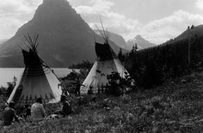 Black and white photograph of Blackfeet on shore of Two Medicine Lake Glacier National Park