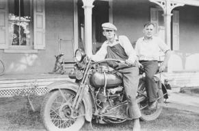 Black and white photograph of Howard Ellsworth Seal, Jr. and Lewis Welch on Harley Davidson motorcycle at Locust Knoll Farm