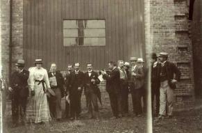 Group of men and women drinking outside the Ardgowan Distillery