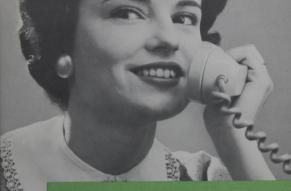 Close-up of a vintage brochure for telephone etiquette. A young woman, styled in the mid-20th century fashion with a bouffant hairstyle and wearing a blouse with a lace collar, is depicted holding a rotary-style telephone